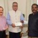 Advisor Khan presents cheque of Rs 5 cr towards J&K Relief Fund on behalf of Haj & Auqaf Department