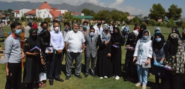 Dr Samoon distributes tablets among meritorious students