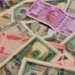 Rupee surges 7 paise to 74.26 against US dollar in early trade