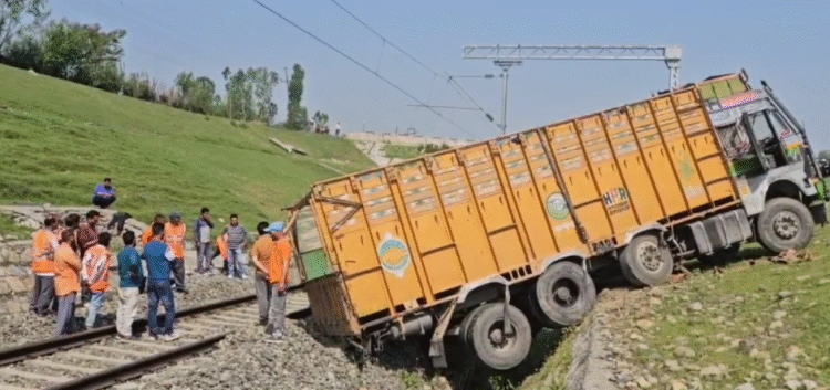 Train services suspended for some time as truck rolls down on track at Qazigund