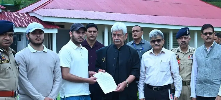 J-K LG hands over appointment letter to son of police constable killed in Anantnag